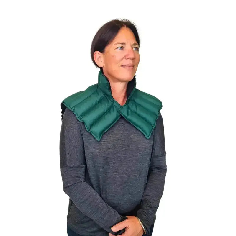 Model wearing green neck & shoulder wheat bag front view