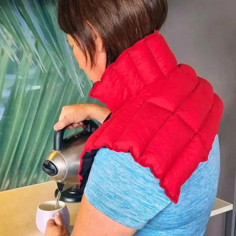 Lady wearing red neck and shoulder wheat bag