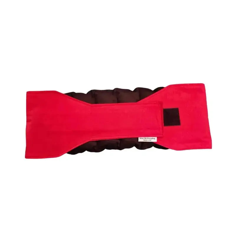 Red waist wheat bag with velcro strap fastened, designed for lower back and period pain relief